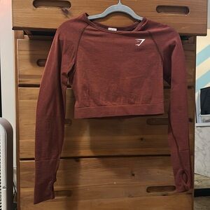Burgundy/maroon gymshark crop top long sleeve. Size L. Can fit M